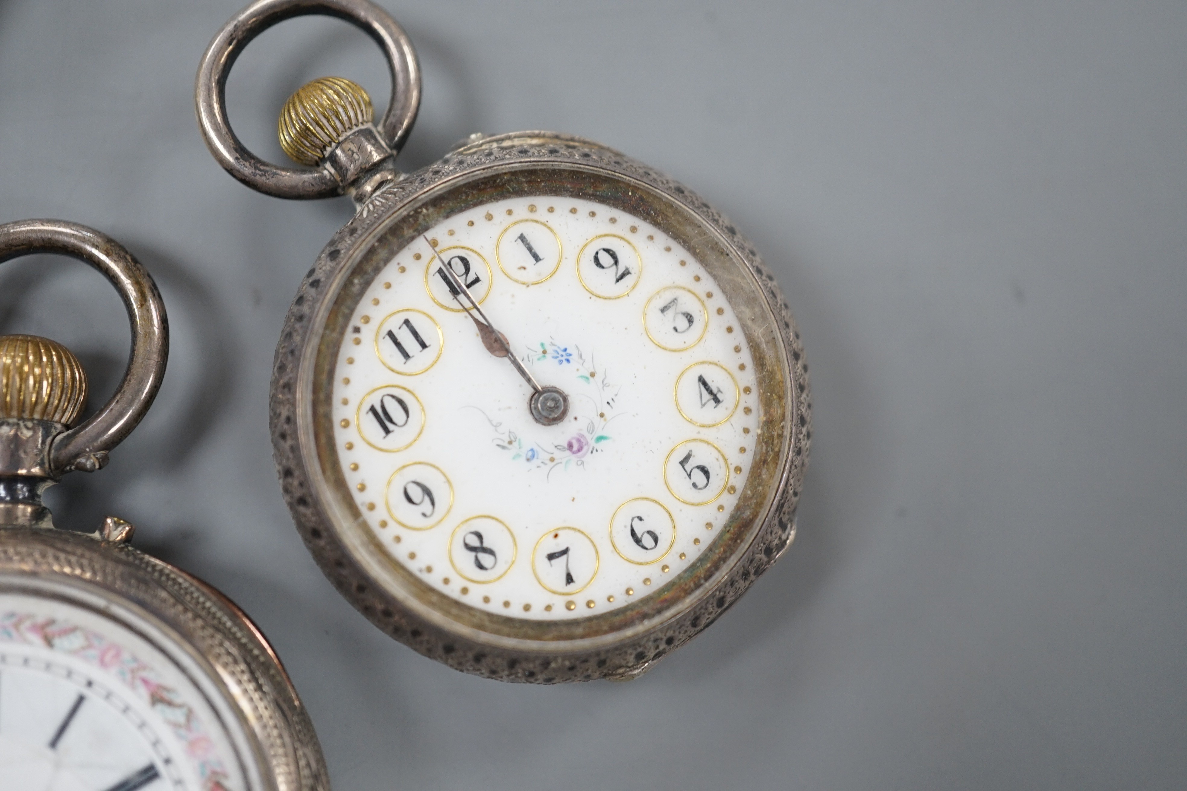 A Swiss 935 white metal open faced pocket watch and two fob watches=, silver a 935 white metal.
